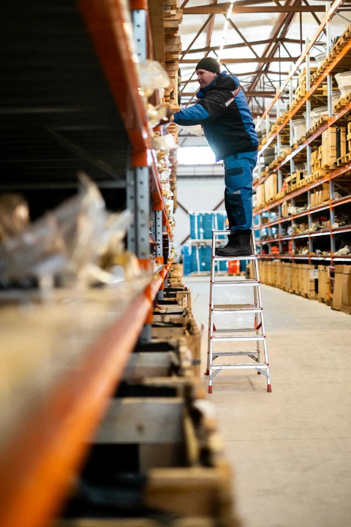 Warehouse professional working among industrial inventory shelves